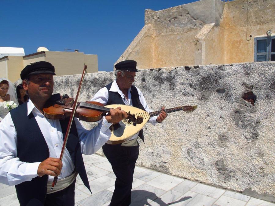 Part of a wedding procession in Oia, Santorini