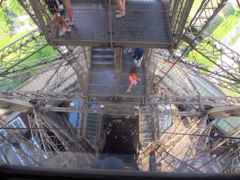 Energetic people walking down the tower stairs