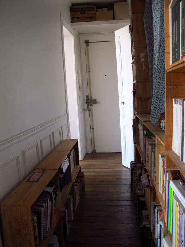 Goodbye to the hallway full of French wine crate book shelves