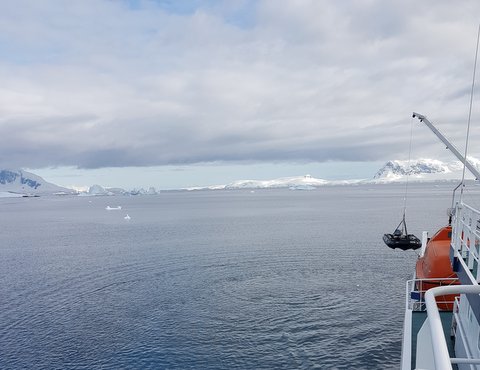 Lowering zodiacs to the water